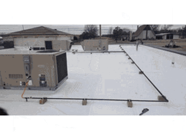 the roof of a building has a large unit on it