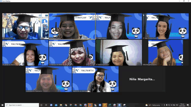 a group of people wearing graduation caps are having a video call