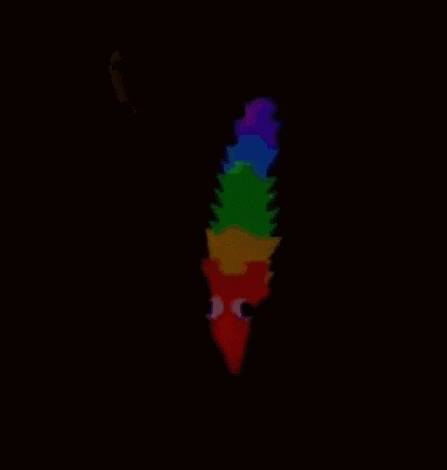 a rainbow colored worm with big eyes is glowing in the dark