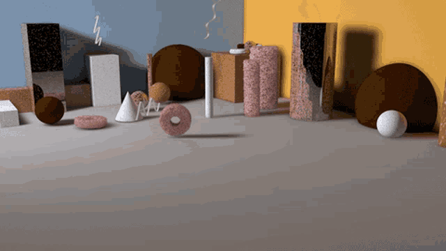 a group of geometric shapes including a donut and a cylinder