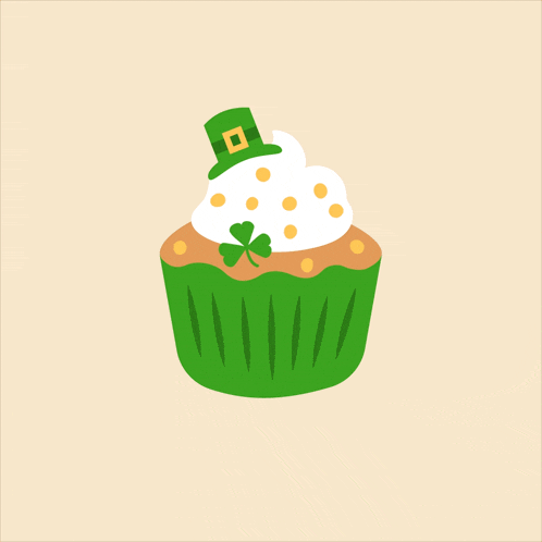 a cupcake with a clover on top and a leprechaun hat on top