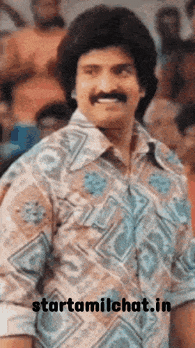 a man with a mustache and a shirt that says starttamilchat.in on it