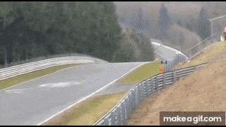 a gif of a race track with the words make a gif.com underneath it
