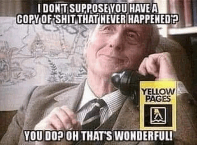 an older man in a suit and tie is talking on a telephone .