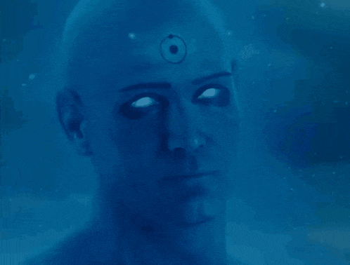 a man with a circle on his forehead and glowing eyes
