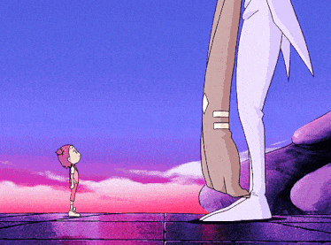a little girl is standing next to a very tall man