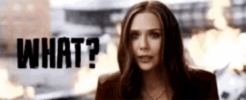 scarlet witch is looking at the camera with the words `` what ? '' in the background .