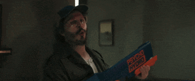 a man is holding a psycho hybrid toy