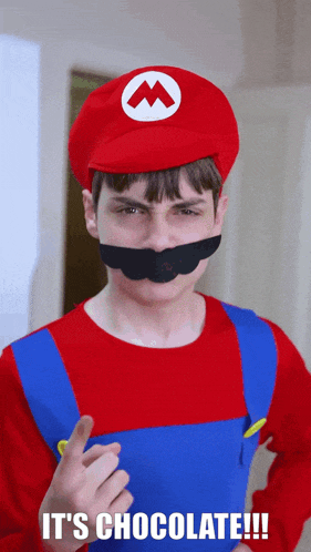 a man in a mario costume with the words " it 's chocolate " on the bottom