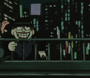 a cartoon character is smiling while standing on a balcony overlooking a city at night