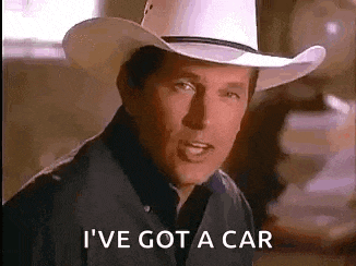 a man wearing a cowboy hat and a black shirt is talking about getting a car .