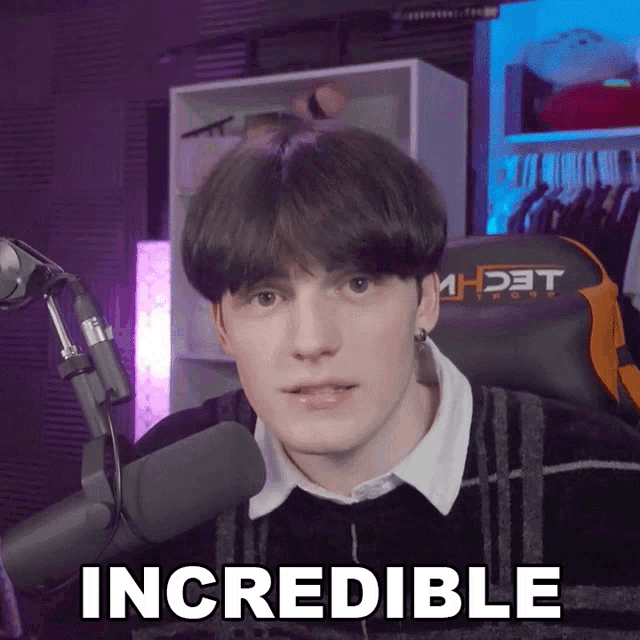 a young man sitting in front of a microphone with the word incredible written on the bottom