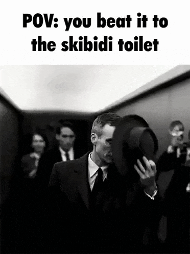 a man in a suit and tie is holding a top hat in front of his face while walking down an elevator .