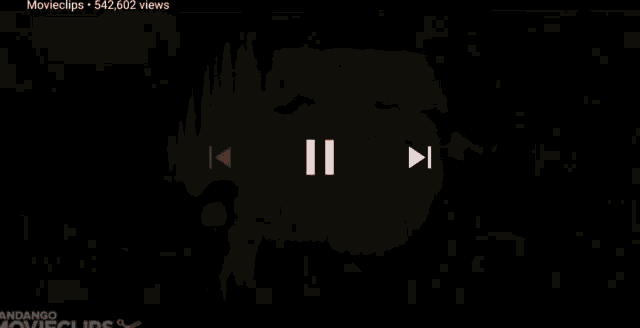 a person holding a flashlight in a dark room with the word movieclips on the bottom right