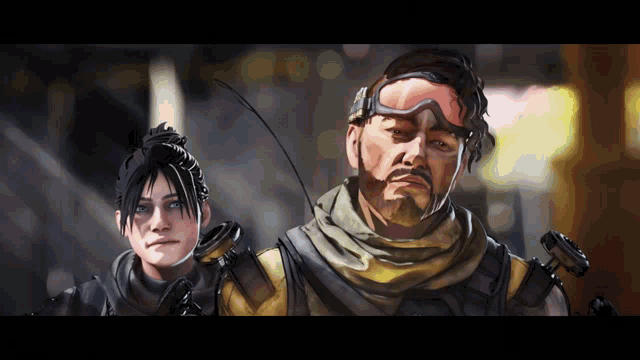 a man with a beard and goggles stands next to a woman