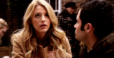a man and a woman are sitting next to each other and talking .