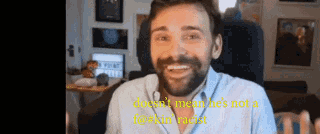 a man with a beard is smiling in front of a sign that says ' no point '