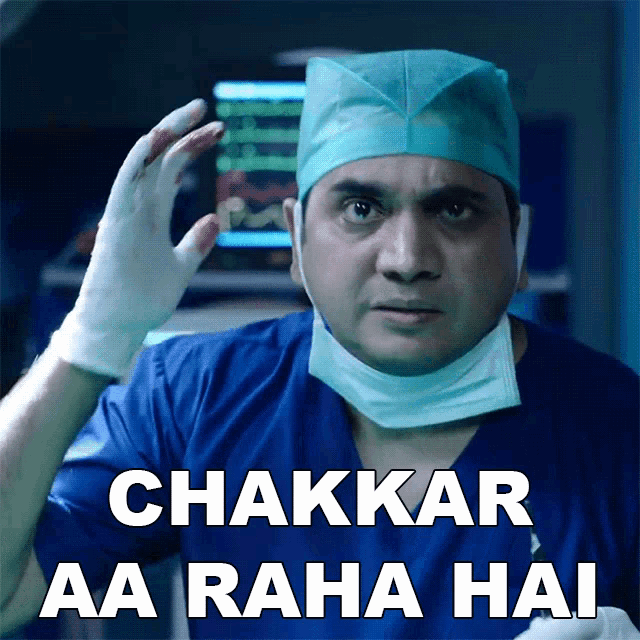 a surgeon wearing a mask and gloves has the words chakkar aa raha hai above his head