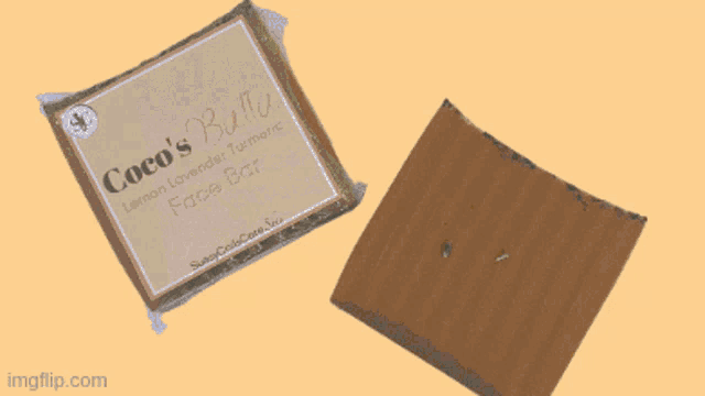 a person holding a piece of coco 's soap