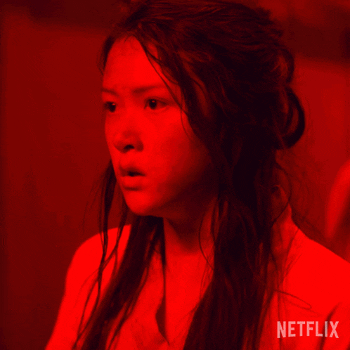 a woman in a red light with the word netflix on the bottom right