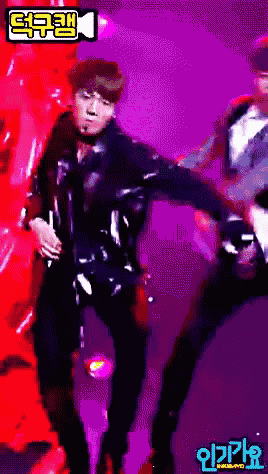 a pixelated image of a man dancing with a purple background and a foreign language written on it