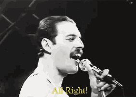 a black and white photo of a man singing into a microphone with the words all right below him