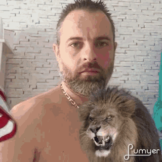 a shirtless man is holding a stuffed lion on his shoulder
