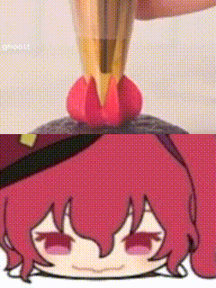 a cartoon girl with red hair and a hat is being decorated with a piping nozzle .