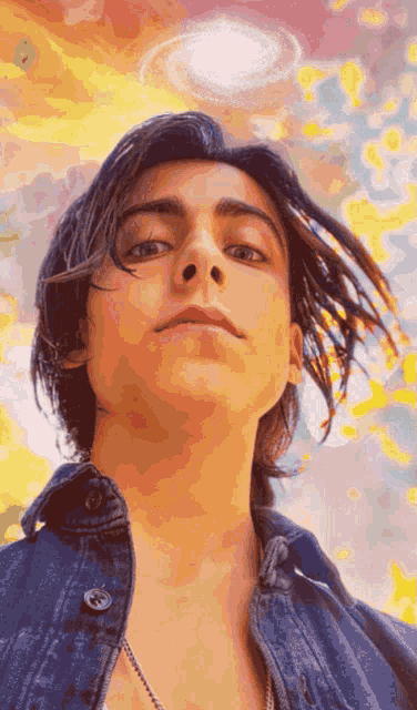 a close up of a person 's face with a swirl in the background