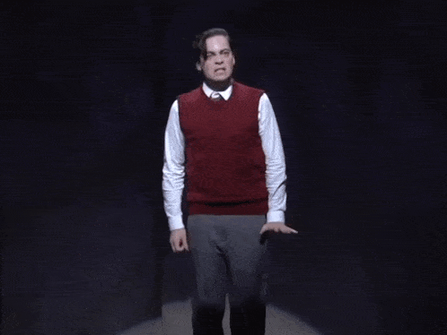 a man and a woman are dancing together on stage