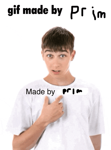 a boy is pointing at his shirt that says made by prim