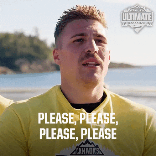 a man wearing a yellow shirt that says canada 's ultimate challenge on it