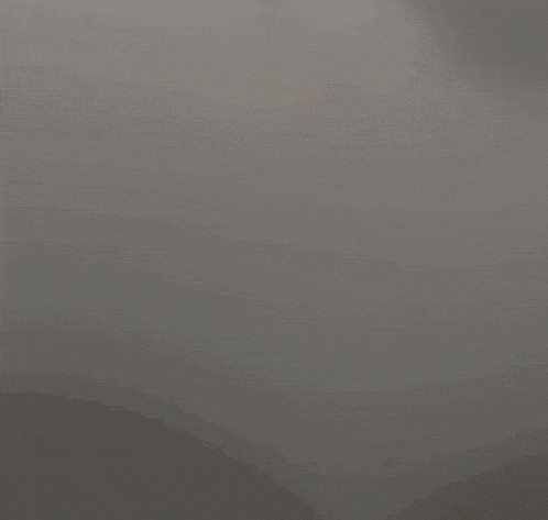a close up of a gray background with a gradient of light and shadow .