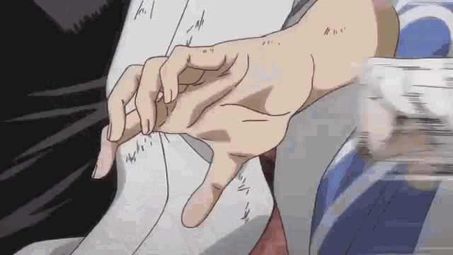 a close up of a person 's hand holding another person 's hand in a cartoon .