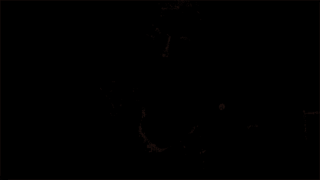 a man in a dark room is holding a light in his hand