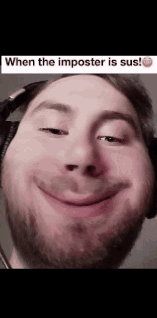 a man with headphones on making a funny face with the caption when the imposter is sus