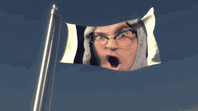 a flag with a picture of a man with glasses on it