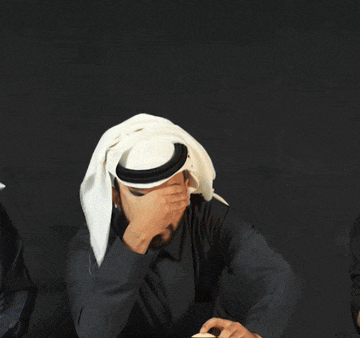 a man wearing a head scarf covering his face
