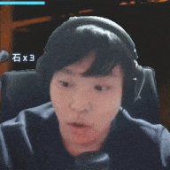 a man wearing headphones looks surprised in front of a computer screen with the number 3 on it