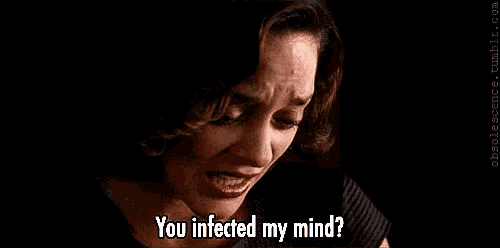 a woman is crying with the words `` you infected my mind '' written on her face .