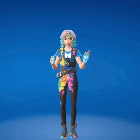 a girl in a colorful outfit stands with her arms in the air