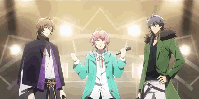 a group of anime characters are standing next to each other on a stage .