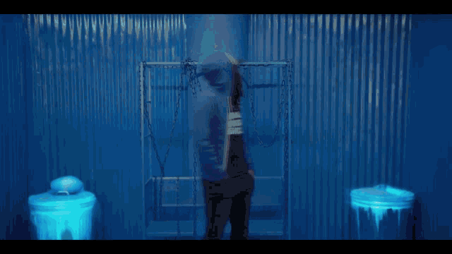 a blurry picture of a person wearing a blue hoodie that says freedom