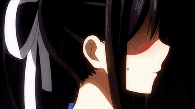 a close up of a girl with red eyes making a funny face