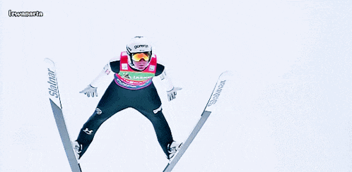 a ski jumper wearing a helmet that says gorenje