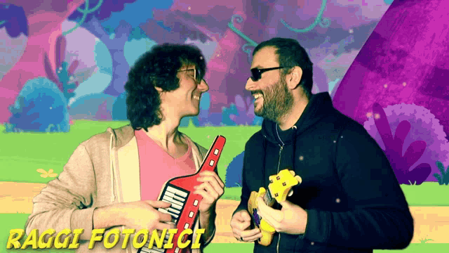 two men holding guitars in front of a colorful background with the words raggi fotonici