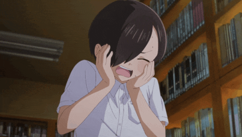 a girl is covering her ears in front of a bookshelf