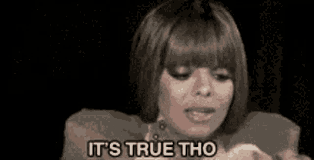 a woman is sticking her tongue out while holding a marshmallow and saying it 's true tho .