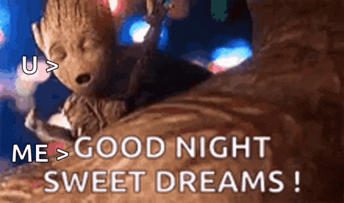 groot from guardians of the galaxy is sleeping on a tree trunk .