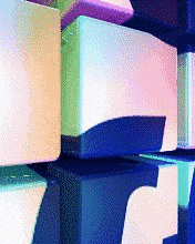 a bunch of colorful boxes are stacked on top of each other